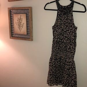 Halter style dress with beaded top. Gathers at hip